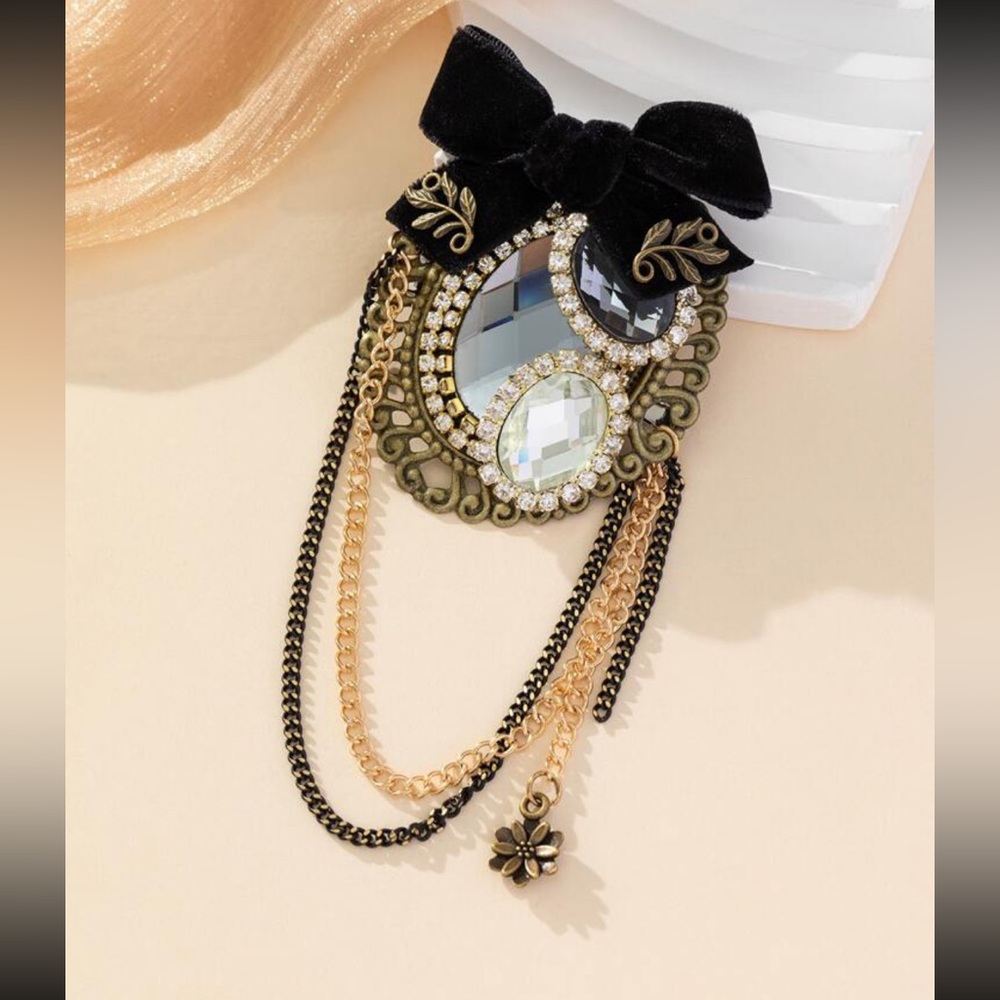 Luxe vintage rhinestone and chain brooch